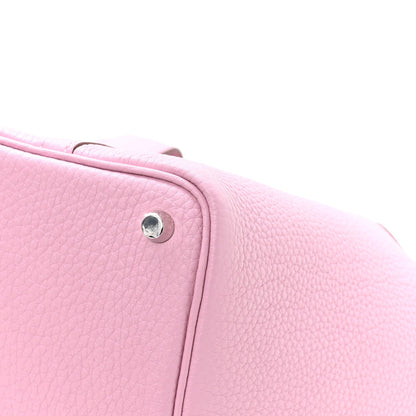 Rose Sakura pink pebbled leather handbag side with metal stud and stitched trim