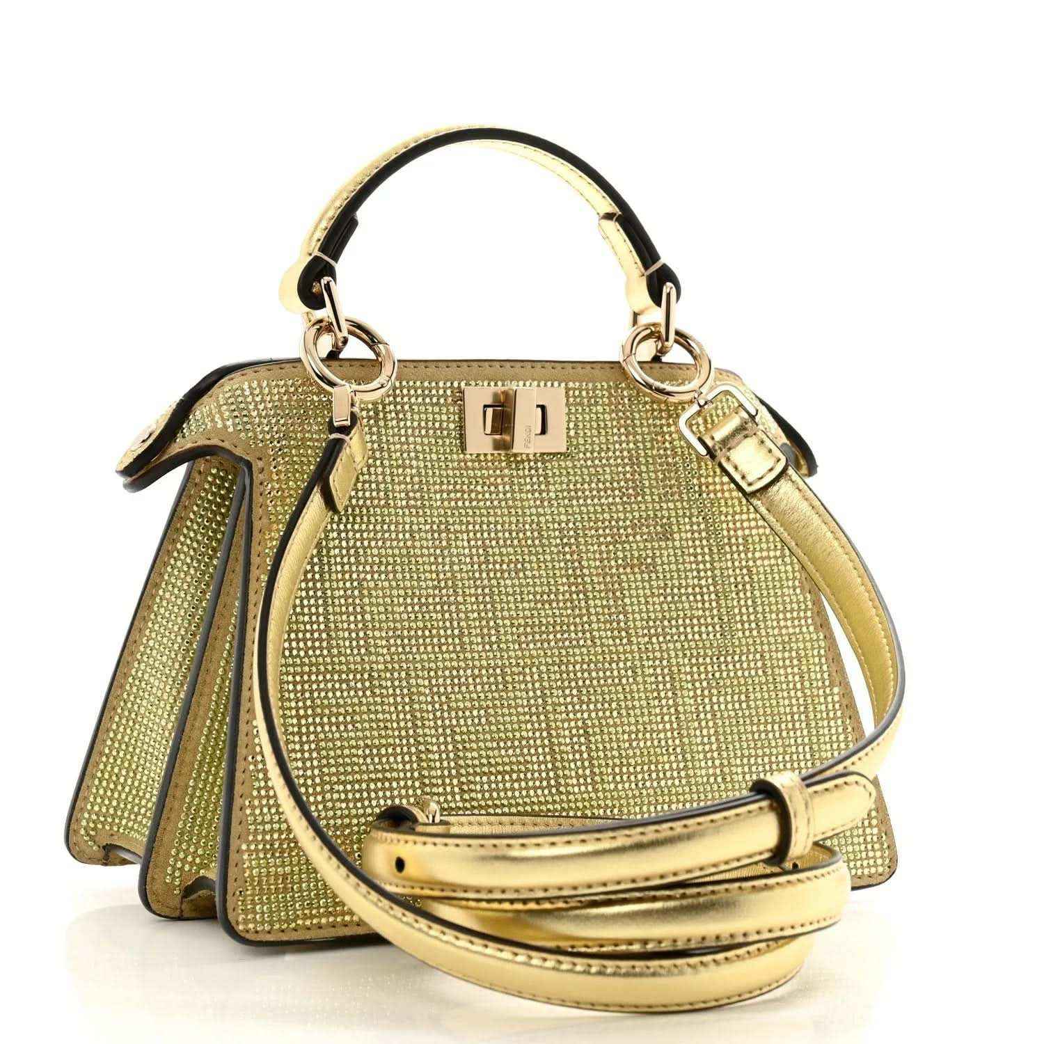 Gold crystal satchel with top handle, front clasp, and crossbody strap with buckle