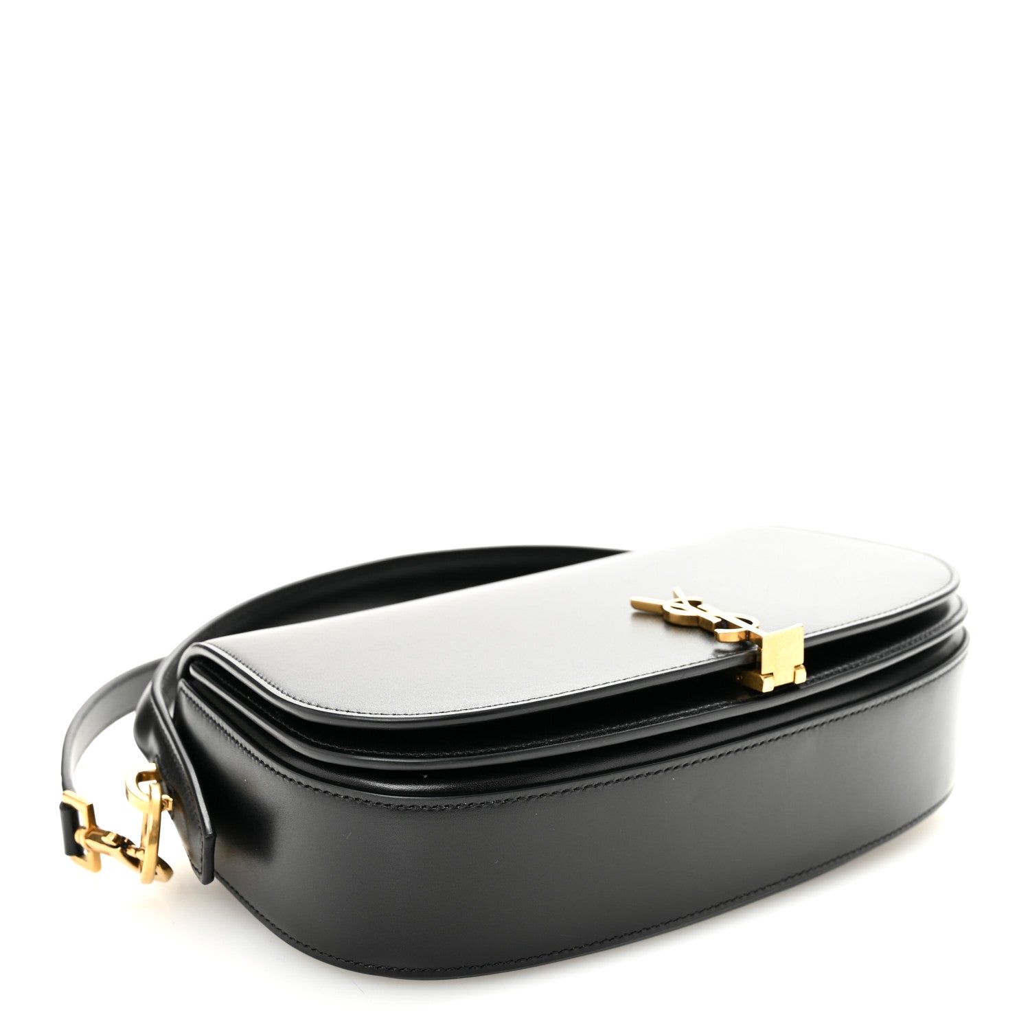 Bicolor crossbody bag with white flap and black body, top clasp with YSL initials.