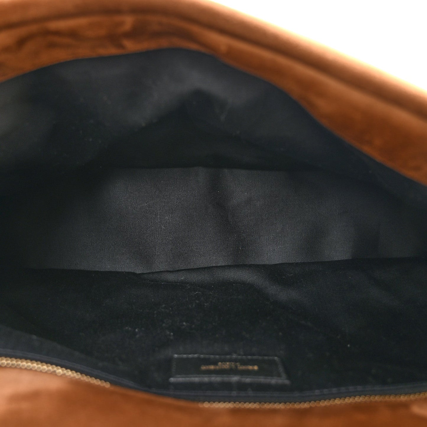 Saint Laurent suede shoulder bag interior with dark fabric lining and top zipper.
