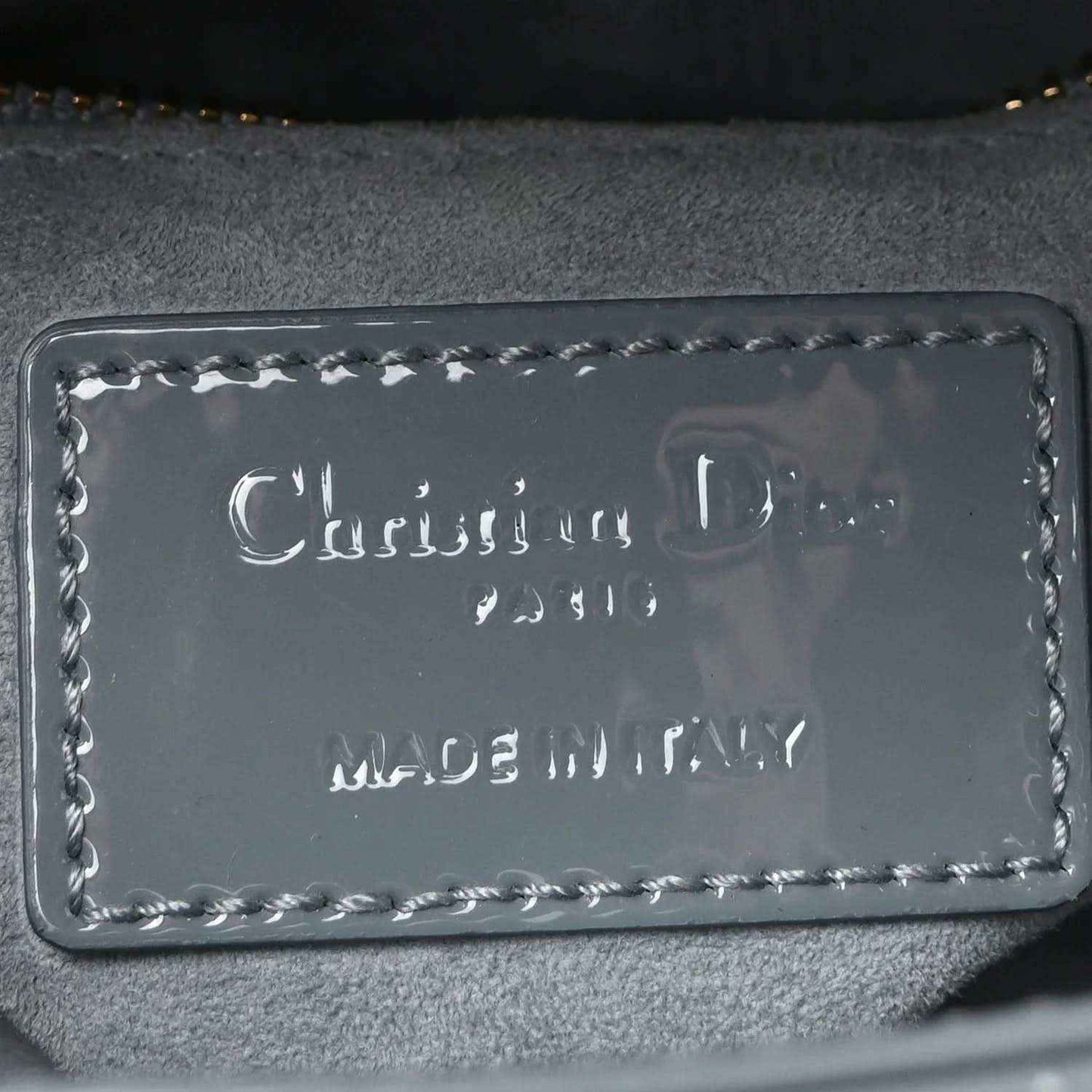 Light blue mini Lady Dior bag leather logo label inside with decorative stitching
