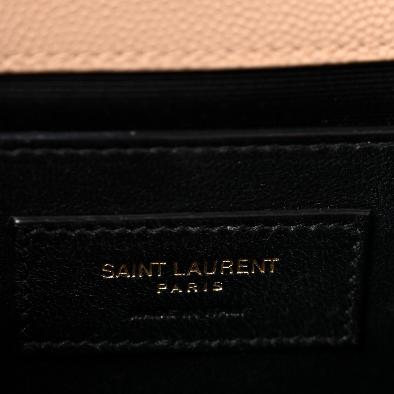 Saint Laurent Paris logo patch on black leather satchel panel