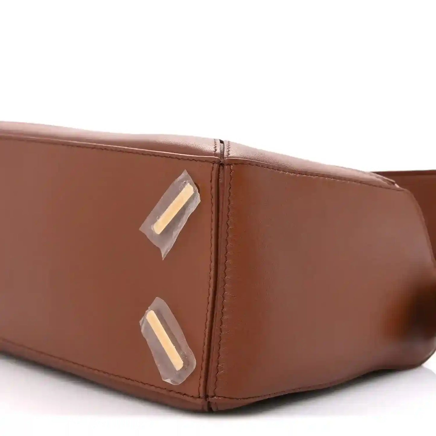 Small Puzzle bag side close-up with gold-tone hardware and top edge stitching
