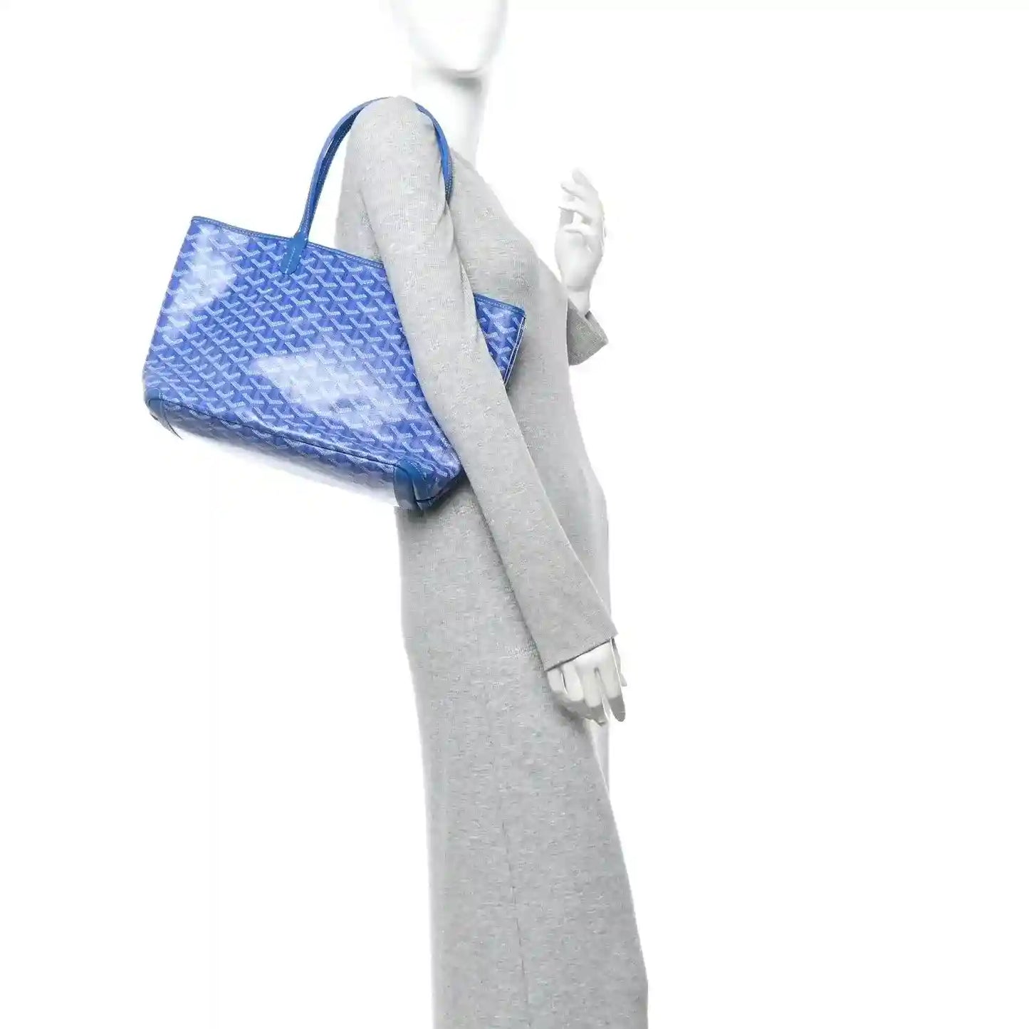 Sky blue tote bag shown angled with top handles and side opening view