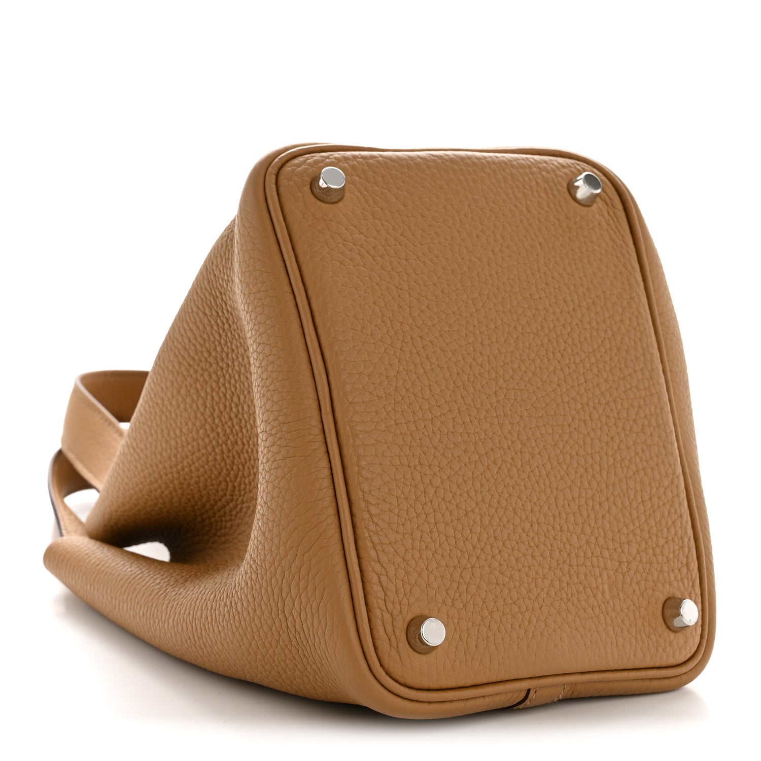 Tan leather bucket bag with grommet hardware and folded top edge