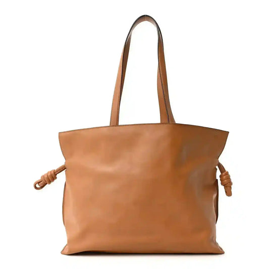 Loewe large Flamenco knot bag in warm tan leather, two top handles and braided side ties.