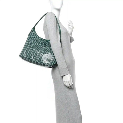 Green chevron hobo bag on mannequin, showing side view and top handle
