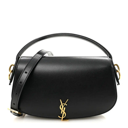 Black box-calf Voltaire top-handle crossbody bag with gold YSL logo clasp.