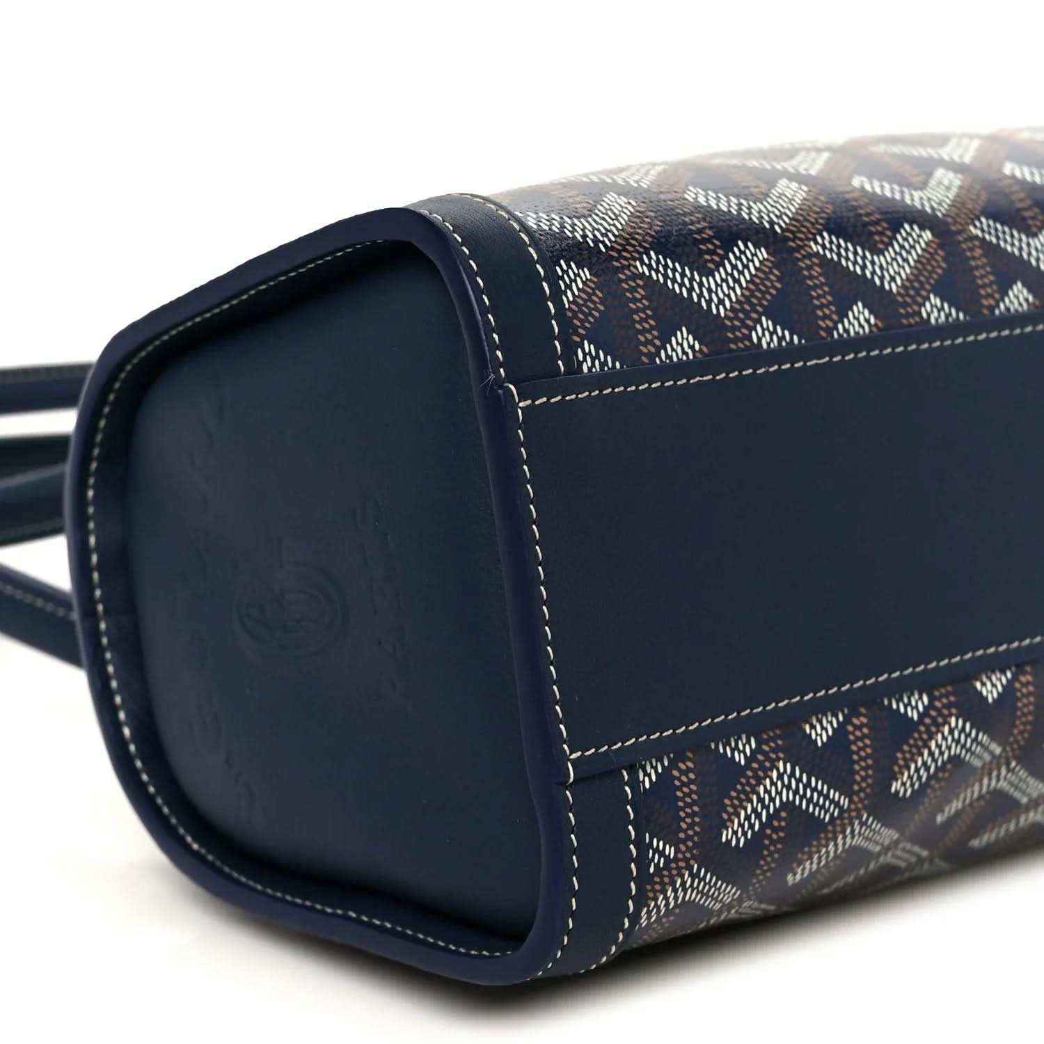 Cylindrical navy Goyardine Bonbonniere bag end with contrast stitching