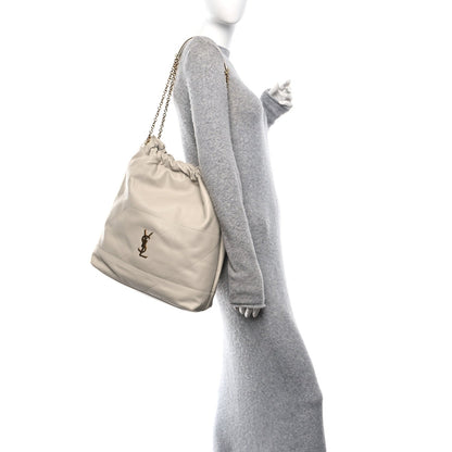 Off-white lambskin shoulder bag on person, YSL logo and chain strap