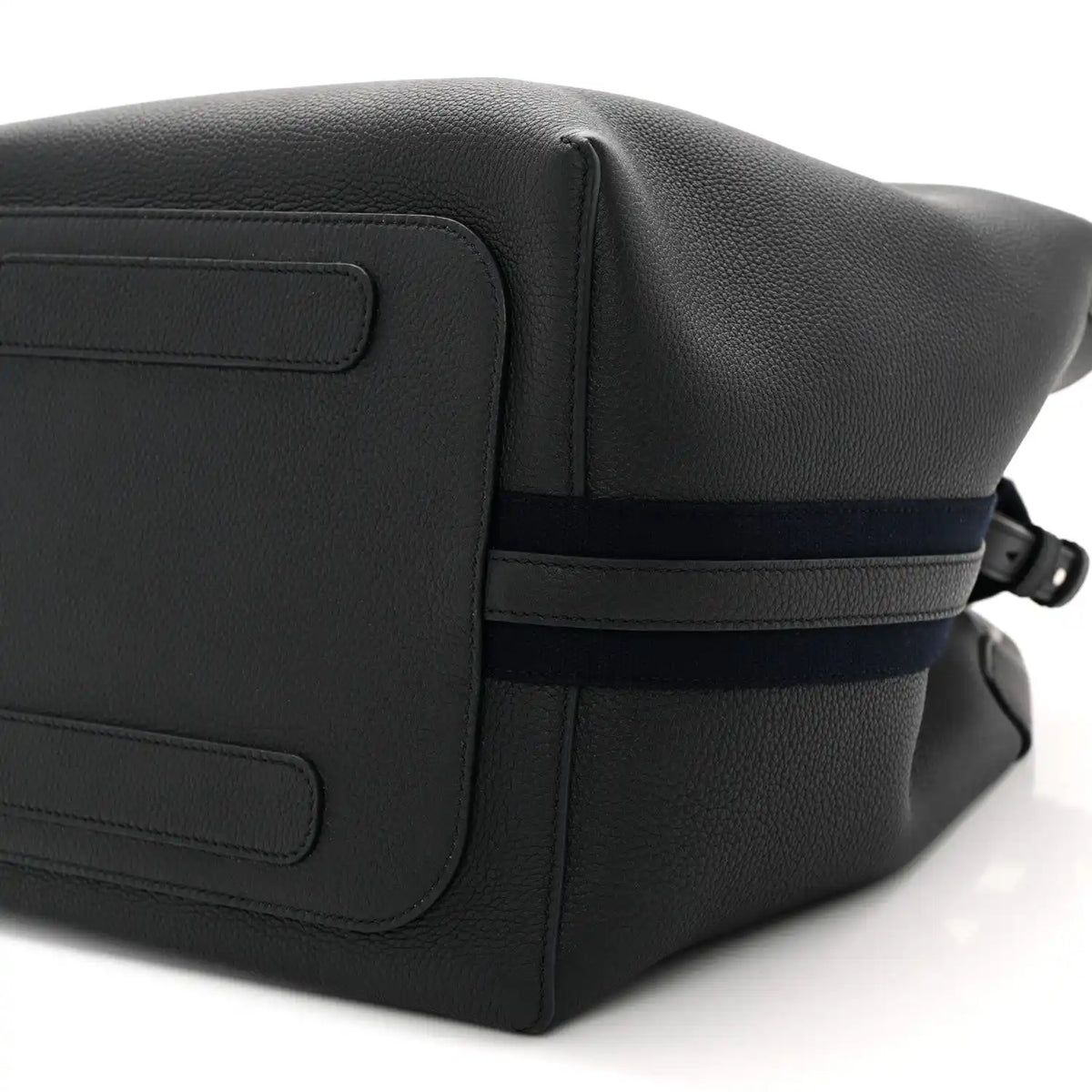 Dark navy leather flap panel with seam details and adjustable crossbody strap