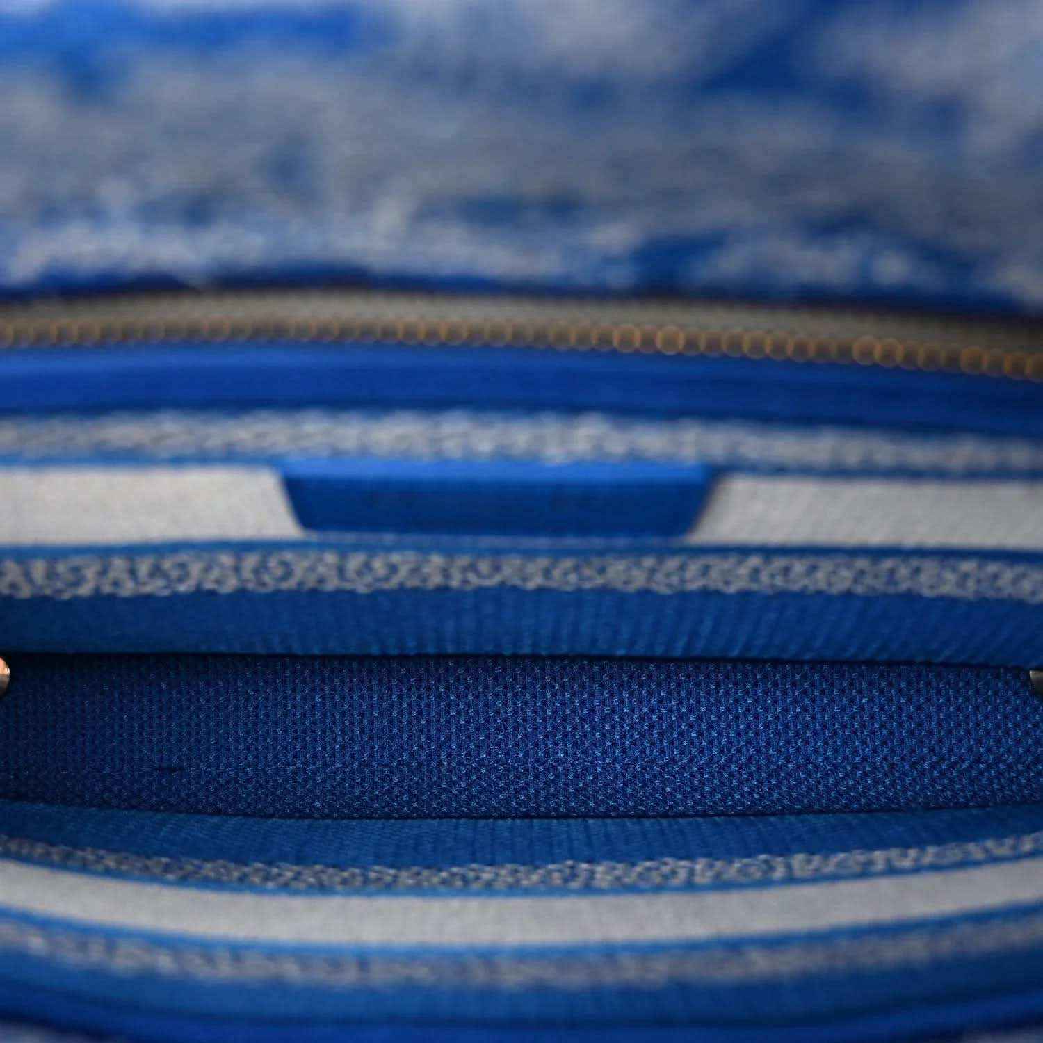Blue toile handbag interior zipper with gold-tone teeth and woven trim