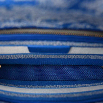 Blue toile handbag interior zipper with gold-tone teeth and woven trim