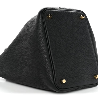Black textured leather tote with gold corner studs and structured shape