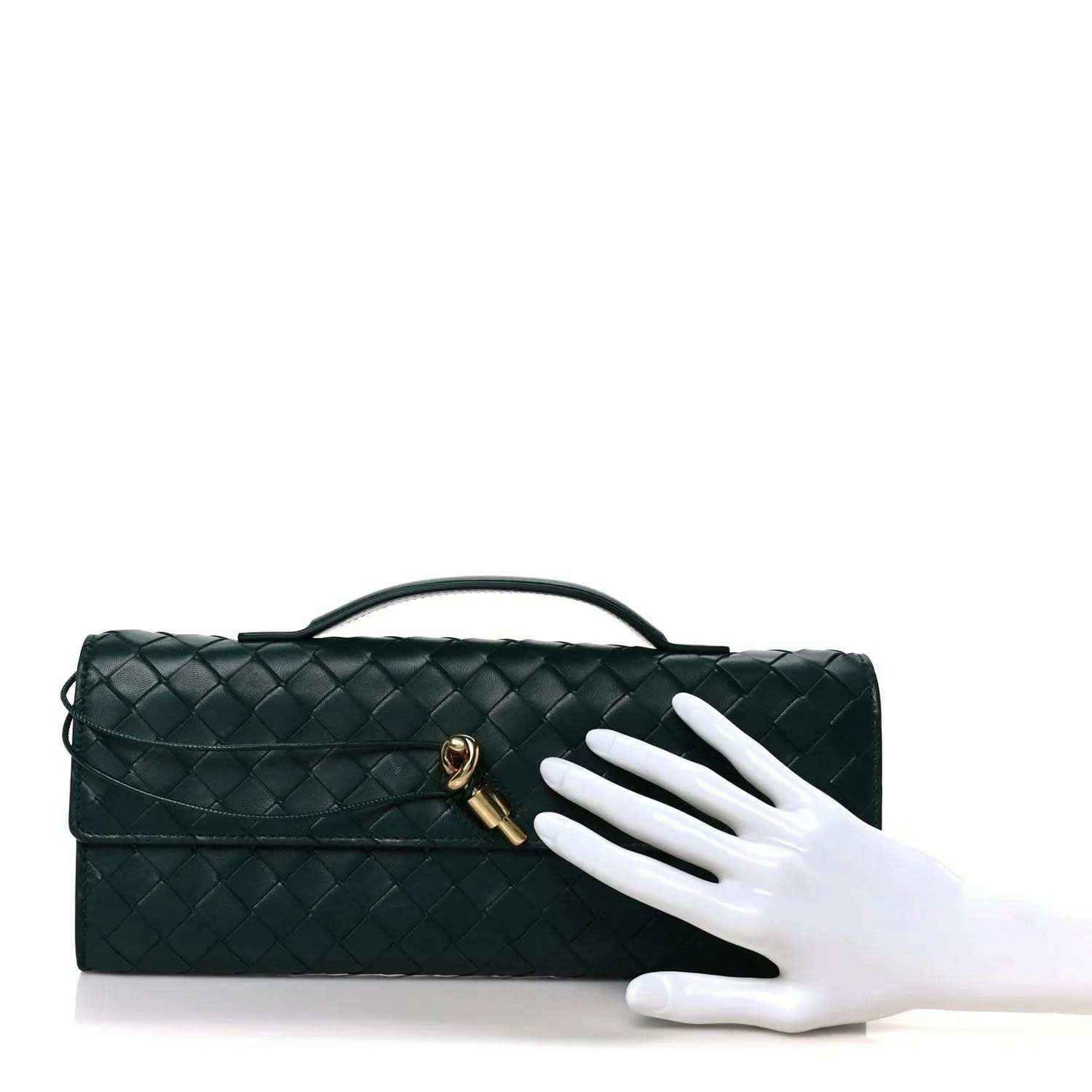 Emerald green intrecciato nappa long clutch bag with top handle and gold clasp, shown by hand