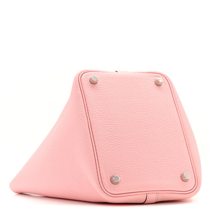 Rose pink leather handbag with triangular top, silver corner studs
