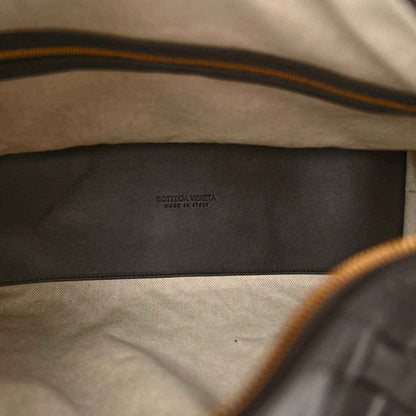 Black leather weekender bag interior lining with Bottega Veneta logo stamp