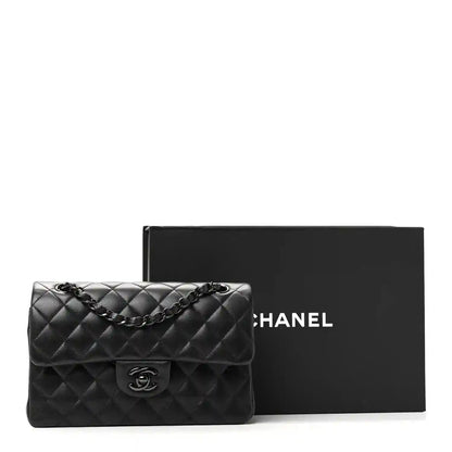 Chanel small quilted double flap bag in black, front flap with CC turn-lock and chain