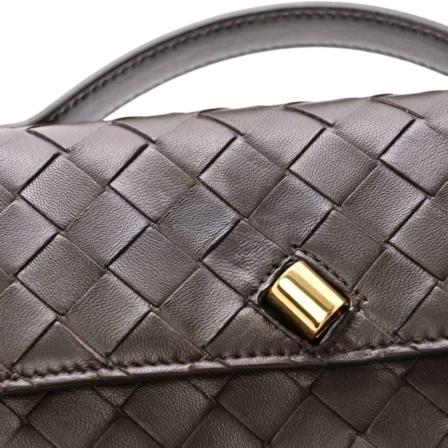 Interlaced nappa leather clutch with gold-tone clasp detail and top handle strap