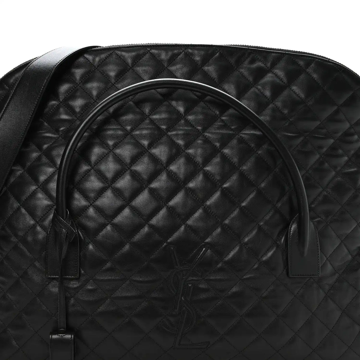 Black quilted leather travel bag with curved handle and embossed monogram on front