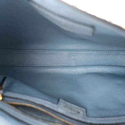 Hobo bag interior with light blue lining and zipper pocket detail