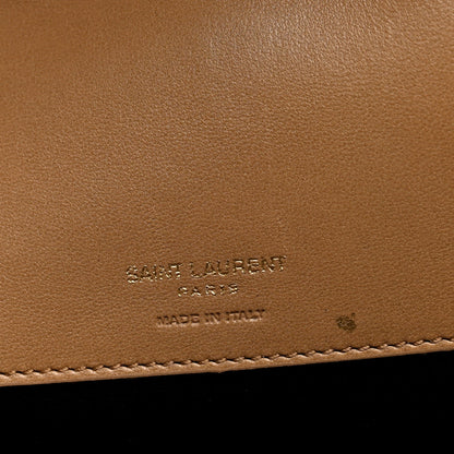 Natural tan leather with embossed SAINT LAURENT Paris markings and stitching
