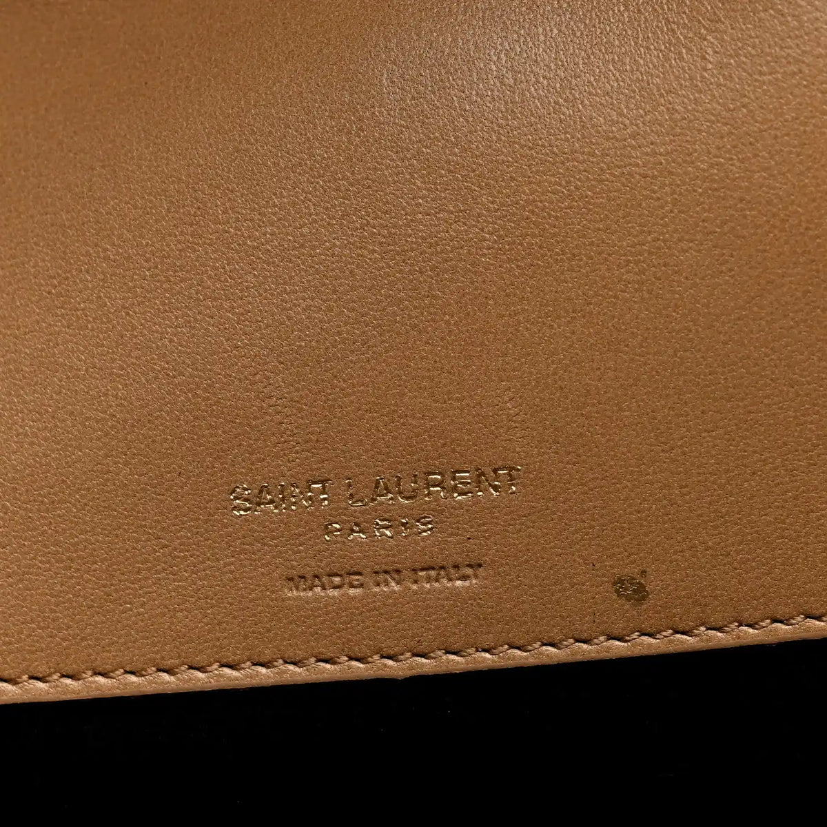 Natural tan leather with embossed SAINT LAURENT Paris markings and stitching
