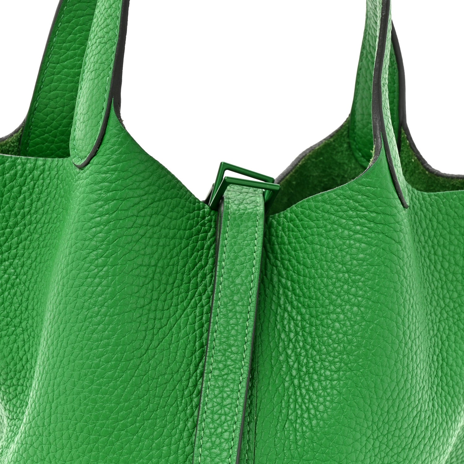 Green leather tote bag with Picotin lock clasp and top handles, front view closeup