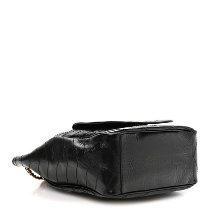 Black leather tote base view with diamond quilting and smooth side panel