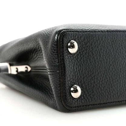Louis Vuitton Capucines BB black leather corner with round stud hardware