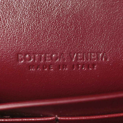 Bottega Veneta embossed logo on barolo leather lining of long clutch