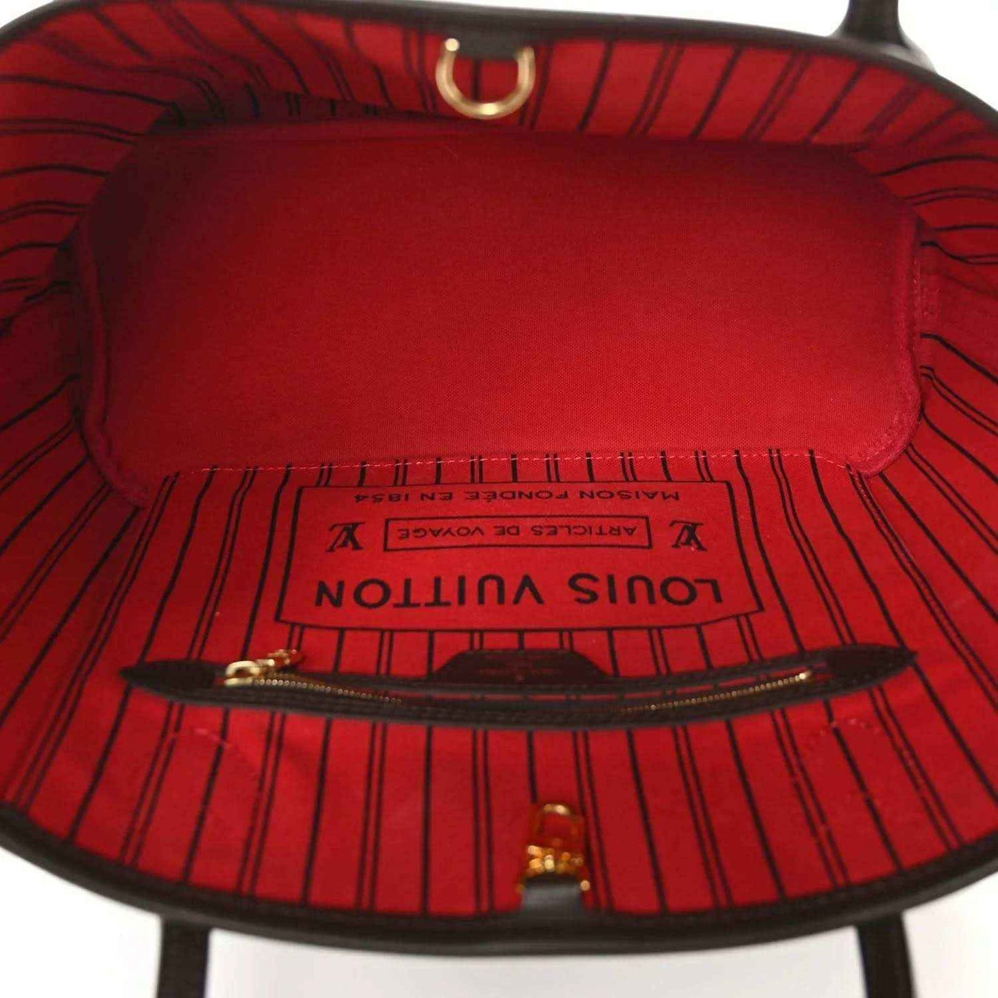 Louis Vuitton Neverfull PM tote interior with red lining and zipper pocket opening