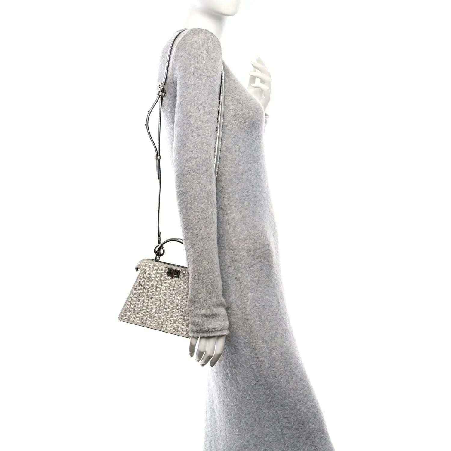 Crystal-embellished mini satchel with short top handles and crossbody strap, silver tone.