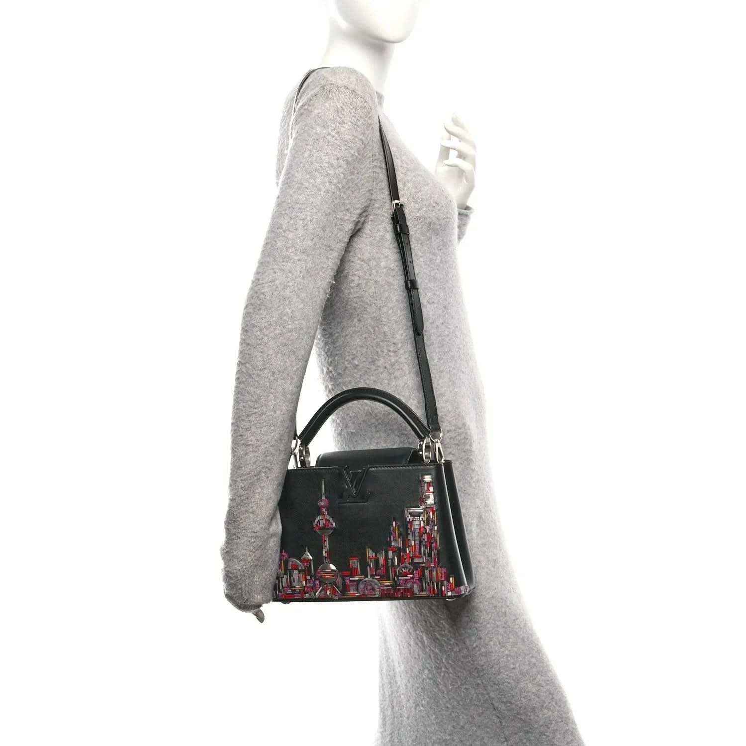 Capucines BB black beaded skyline bag worn on shoulder with long strap
