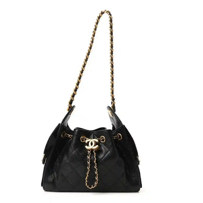 Black leather quilted mini handbag with gold chain and drawstring closure