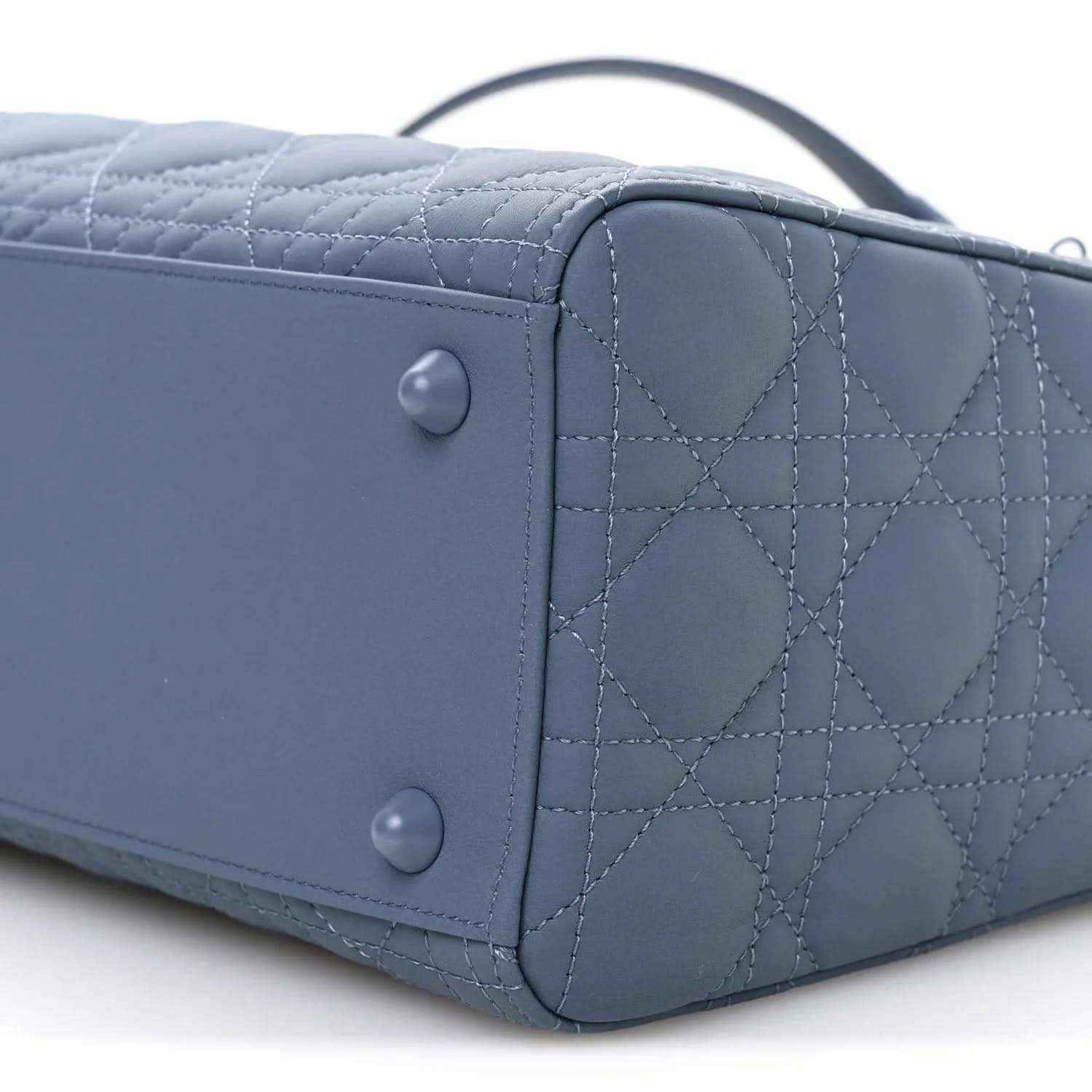 Denim blue quilted Lady Dior bag back panel with snap closures