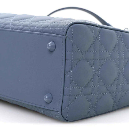 Denim blue quilted Lady Dior bag back panel with snap closures