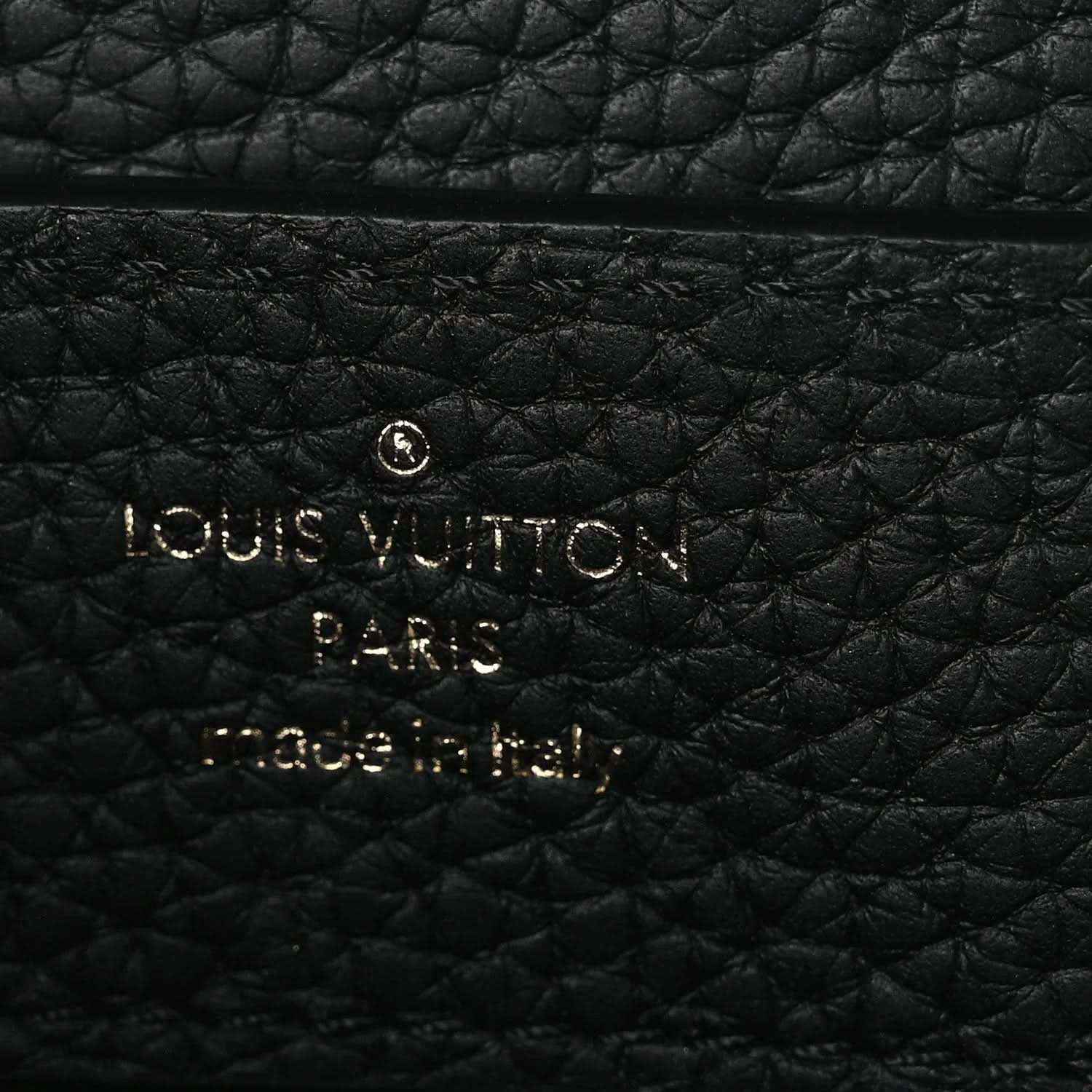 Louis Vuitton Paris embossed on black leather handbag panel