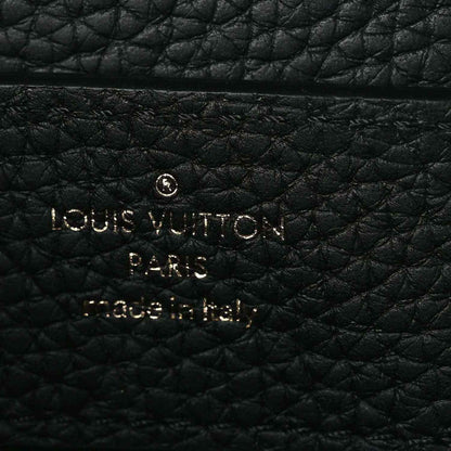 Louis Vuitton Paris embossed on black leather handbag panel