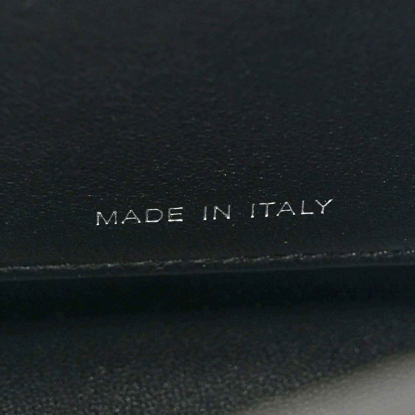 Fendi leather satchel label reading "MADE IN ITALY"