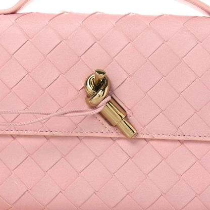 Bottega Veneta Rose pink intrecciato nappa clutch with gold-tone clasp detail
