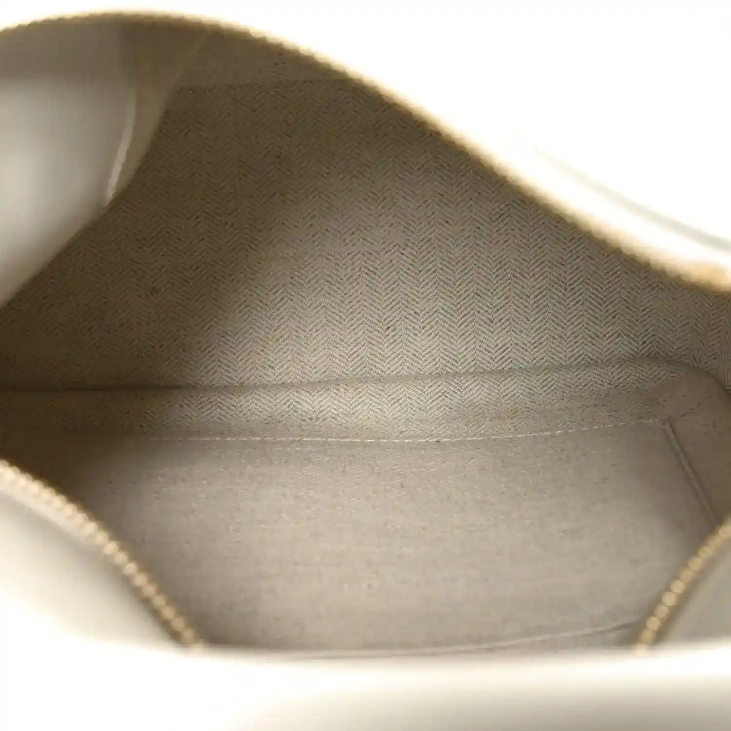 Small Puzzle edge bag interior view with fabric lining and stitched inner seams