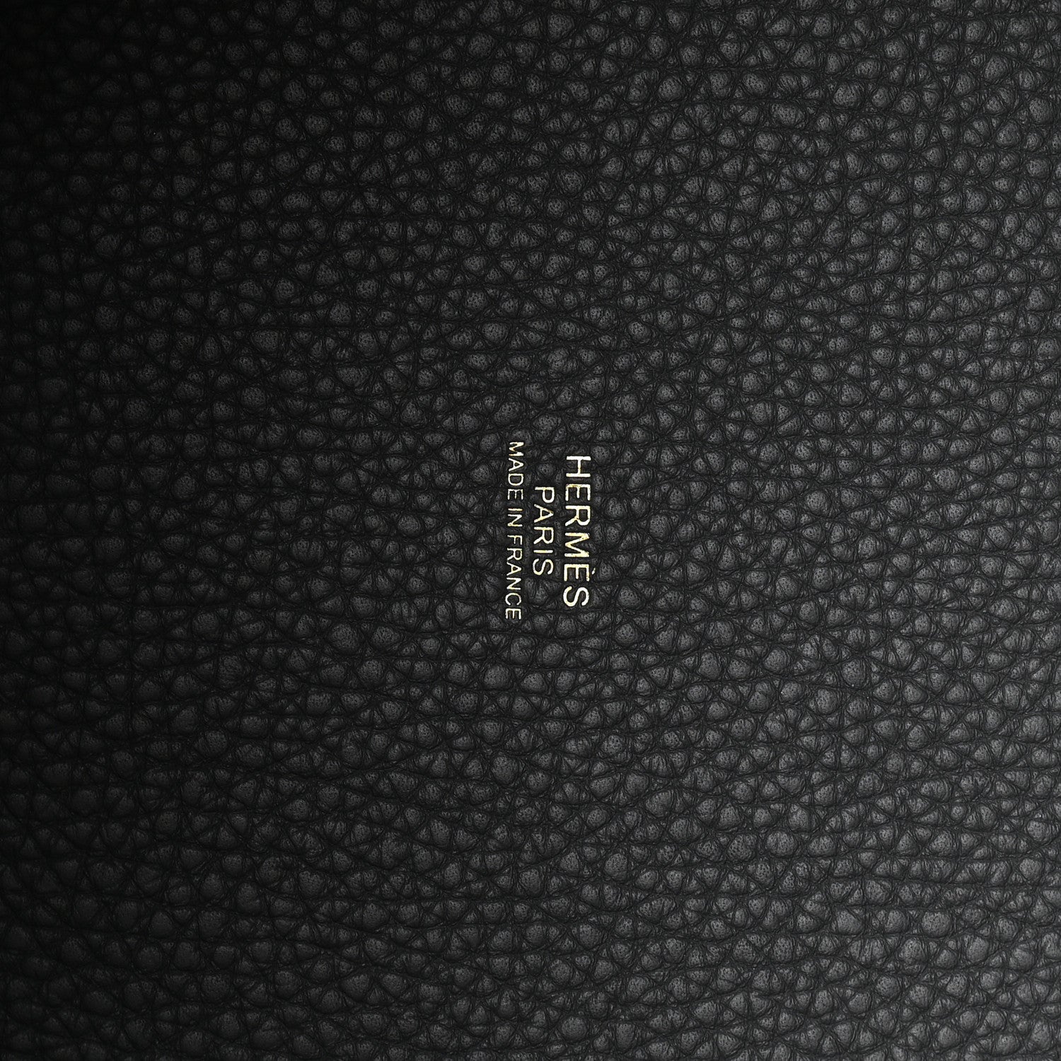 Leather lining in dark gray with embossed text reading "FRAMES" and "Taurillon"