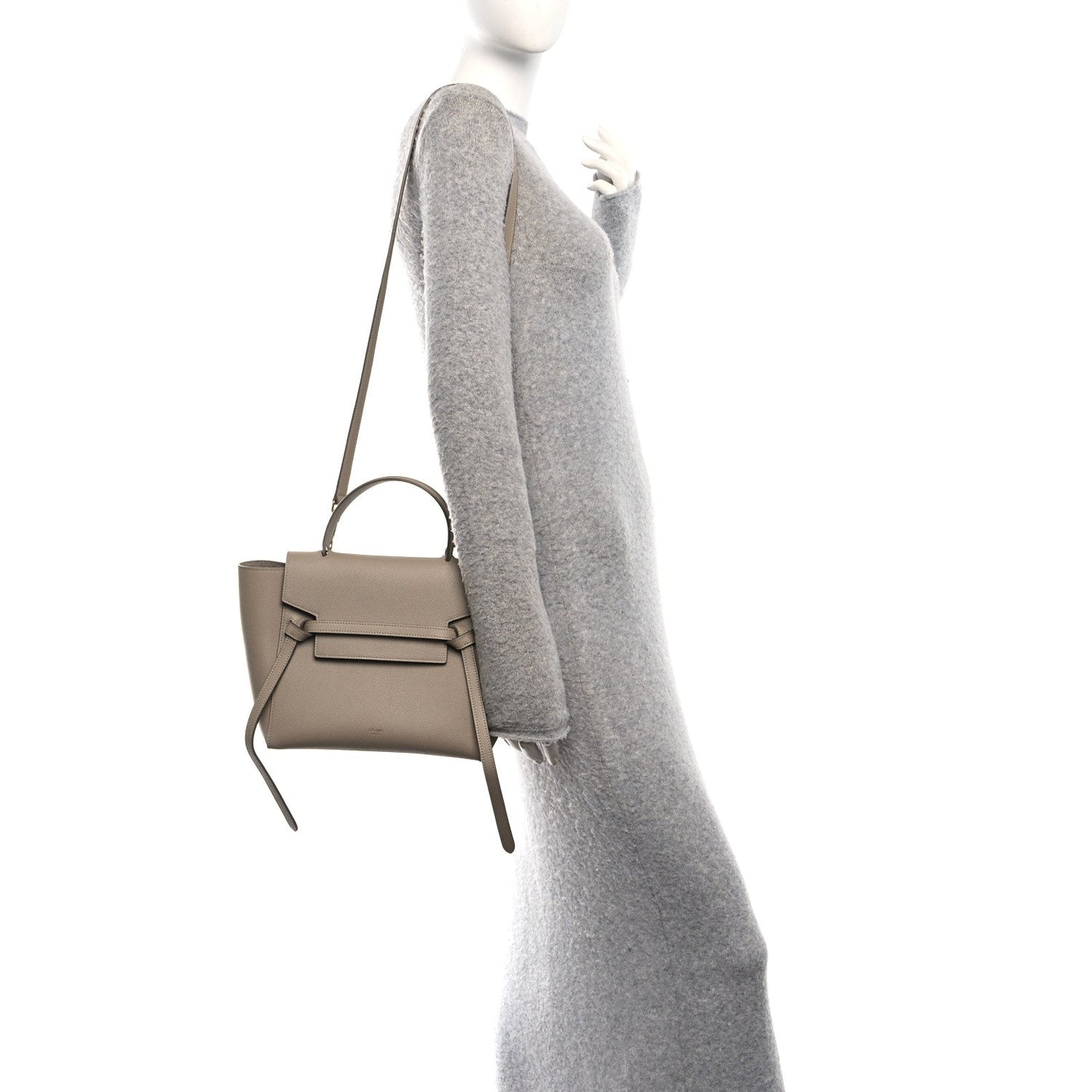 Celine light taupe micro belt bag on a model, side view with crossbody strap