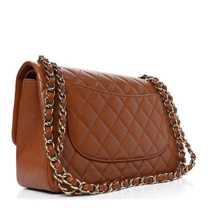 Chanel Jumbo Double Flap brown quilted leather bag, side view with chain strap