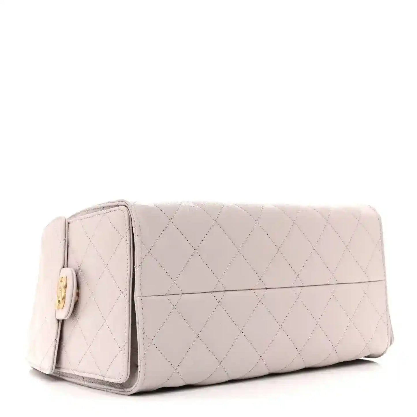 Lilac quilted mini handbag with front flap pocket and gold-tone hardware, structured shape