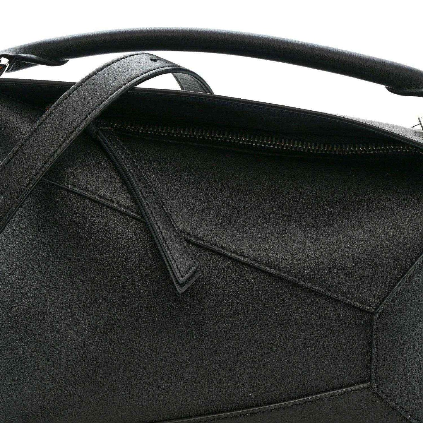 Small Puzzle Edge shoulder bag interior view with black leather pocket and zipper
