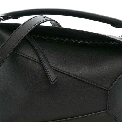 Small Puzzle Edge shoulder bag interior view with black leather pocket and zipper