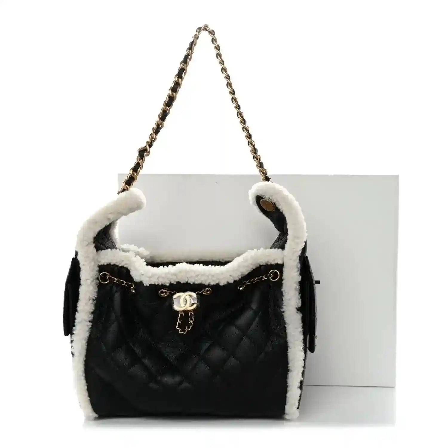 Chanel quilted handbag with shearling trim, black exterior and white interior, chain handle