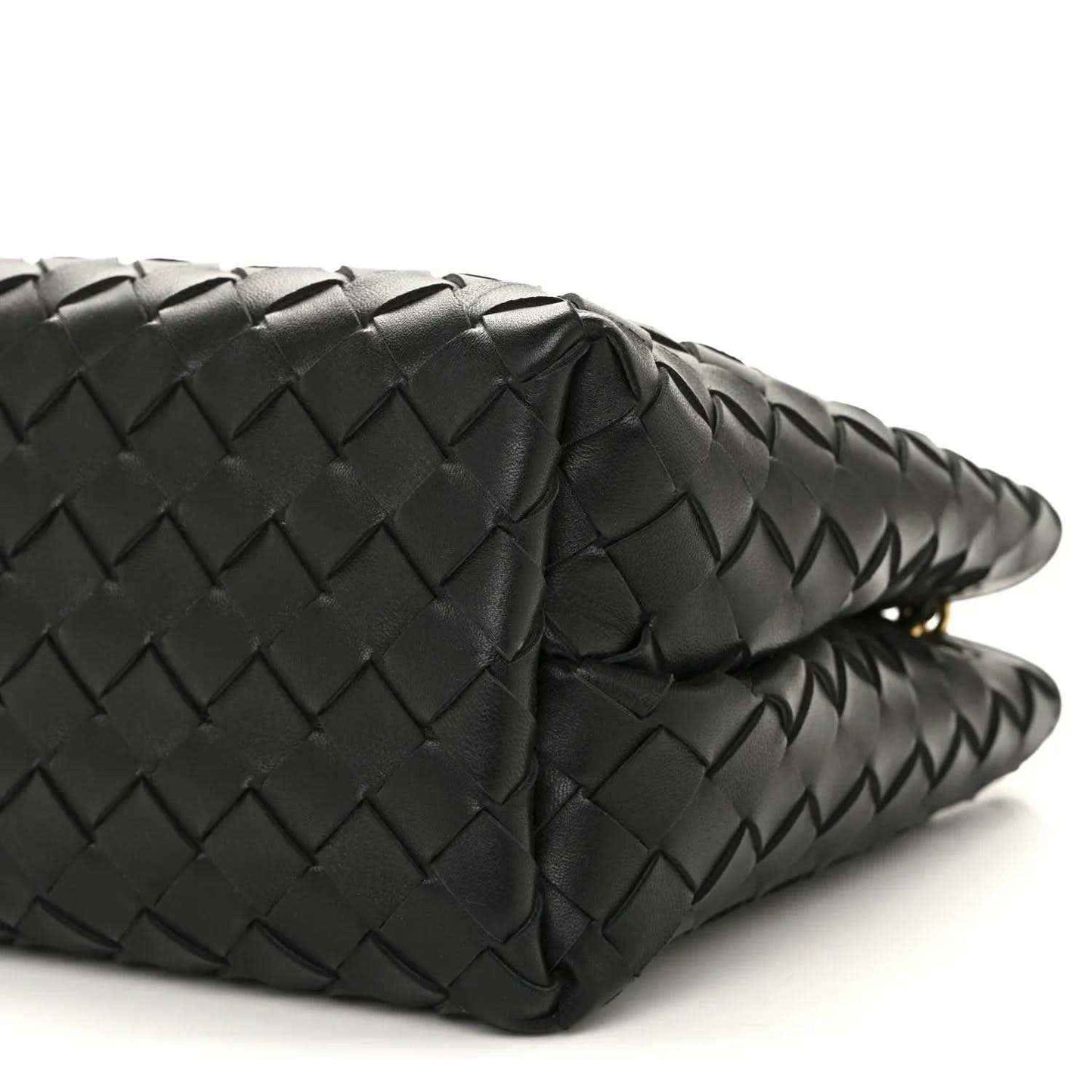 Black woven leather bag with curved corner and stitched pattern detail